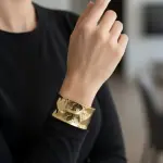 Elegant golden bracelet with a wide design BR-105